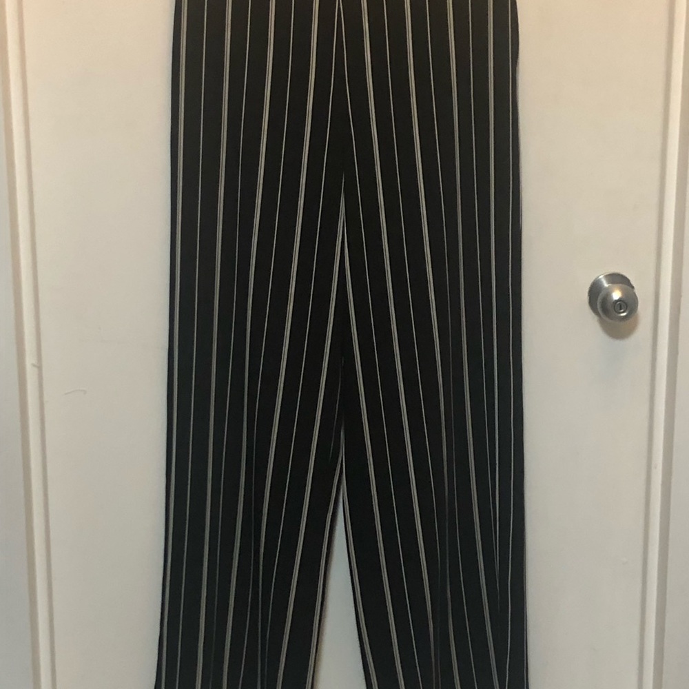 Black palazzo pants with white pinstripes.